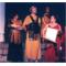 Hippolyta (Sara Peters) & Theseus (Gregory Newton) listen to Philostrate (Emmalyn Bernhardt) read from the list of plays to be performed at their wedding while the courtier (Seth Newton) looks on.